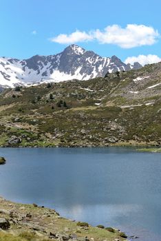 Beautiful view hiking in the Andorra Pyrenees Mountains in Ordino, near the Lakes of Tristaina.