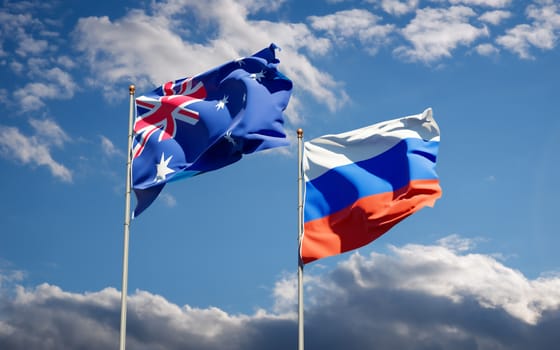 Beautiful national state flags of Russia and Australia together at the sky background. 3D artwork concept. 