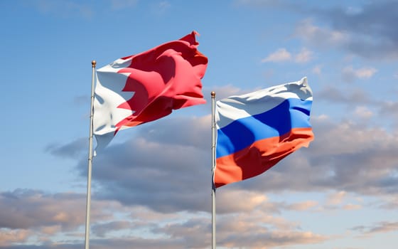 Beautiful national state flags of Russia and Bahrain together at the sky background. 3D artwork concept. 