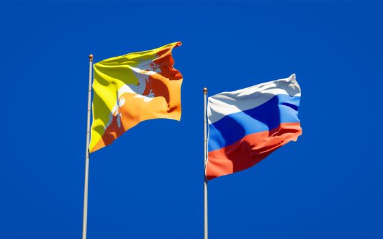 Beautiful national state flags of Russia and Bhutan together at the sky background. 3D artwork concept. 
