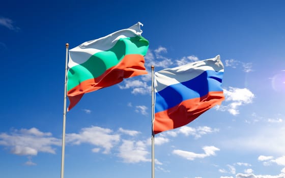 Beautiful national state flags of Russia and Bulgaria together at the sky background. 3D artwork concept. 