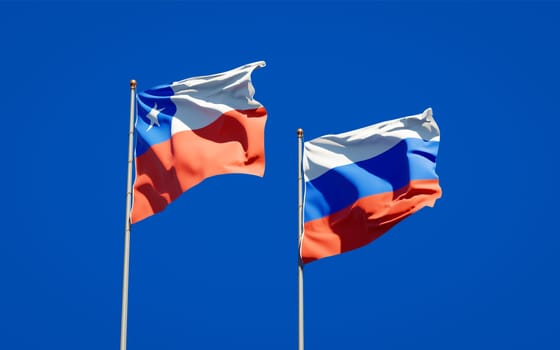 Beautiful national state flags of Russia and Chile together at the sky background. 3D artwork concept. 