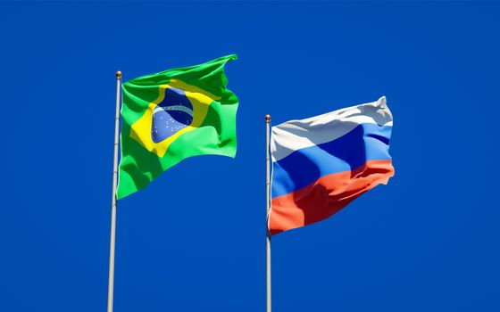 Beautiful national state flags of Brazil and Russia together at the sky background. 3D artwork concept. 