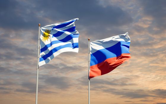 Beautiful national state flags of Uruguay and Russia together at the sky background. 3D artwork concept. 