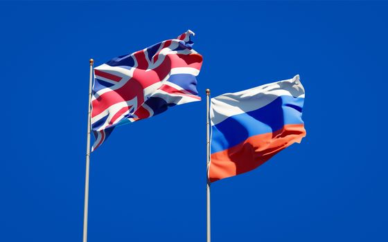 Beautiful national state flags of UK and Russia together at the sky background. 3D artwork concept. 