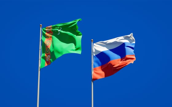 Beautiful national state flags of Turkmenistan and Russia together at the sky background. 3D artwork concept. 