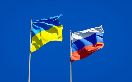Beautiful national state flags of Ukraine and Russia together at the sky background. 3D artwork concept. 