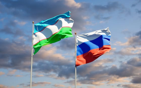 Beautiful national state flags of Uzbekistan and Russia together at the sky background. 3D artwork concept. 