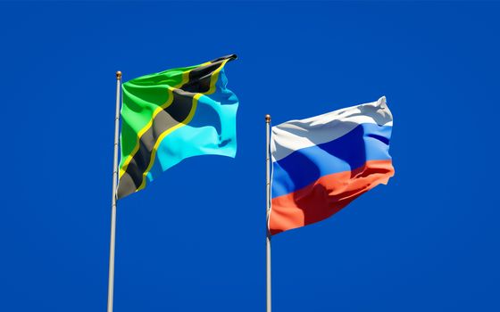 Beautiful national state flags of Tanzania and Russia together at the sky background. 3D artwork concept. 