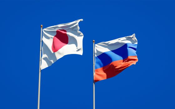 Beautiful national state flags of Japan and Russia together at the sky background. 3D artwork concept. 