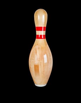 Wooden pin for bowling isolated on a black background.