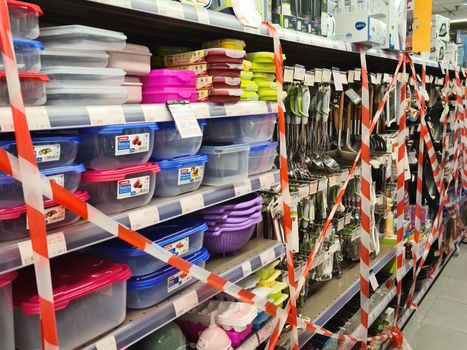 Ribbons on store shelves after Hellenic government forbids the sale of certain goods on malls.
