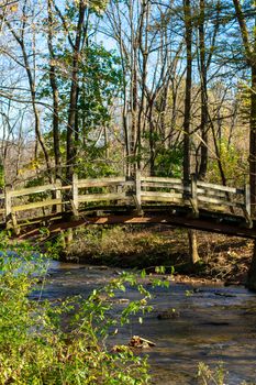 A Wooden Bridge Going Over a Small Stream on a Clear Autumn Day at Valley Forge National Historical Park