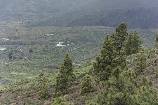 Mountain landscape. A winding road in a mountainous area. Stock photo