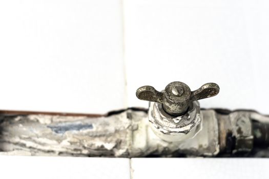 a worn ball valve with a rusty throttle valve. Safety valve to open or close the gas or water flow