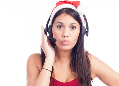 Christmas headset woman from telemarketing call center wearing red santa hat talking smiling isolated on white background.