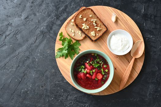 Traditional Ukrainian Russian vegetable soup, borsch with garlic donuts and bread.