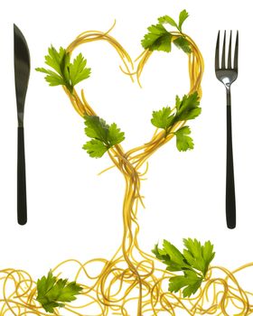 Swirls of cooked spaghetti with fork. Spaghetti heart shape