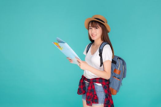 Beautiful happy young asian woman travel holding and looking a paper map isolated on blue background, asia girl search journey with direction in vacation trip with cheerful for leisure.