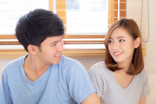 Beautiful portrait young asian couple relax and satisfied together in bedroom at home, family sitting on bed confident with cheerful and happy with relationship, man and woman dating.