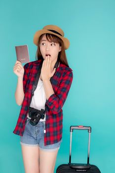 Beautiful young asian woman gesture surprise and travel summer trip with luggage and holding passport for abroad in vacation, asia girl shocked having camera with suitcase for journey in holiday.