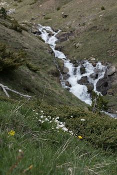 Waterfall in Montaup river in Canillo, Andorra in spring.