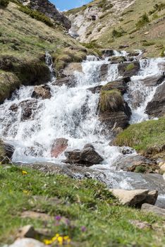 Waterfall in Montaup river in Canillo, Andorra in spring.