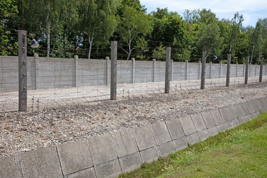 Dachau, Bavaria, Germany - July 13, 2020: Ditch and fence, Dachau Concentration Camp, near Munich, Bavaria, Germany, Europe