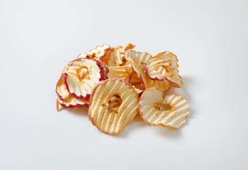 Heap of dried apple slices - apple chips or rings