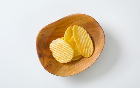 Bowl of thin ridged potato chips