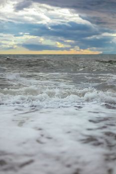 summer Sea or ocean cloudy sky, wave after storm with splash. Space for text.