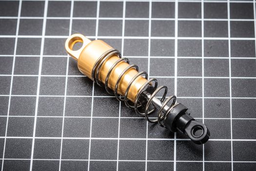 RC car chassis and parts being built to form a radio controlled race car.