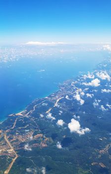 The view from the airplane window to the ground. Landscape view from the sky.