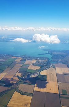 The view from the airplane window to the ground. Landscape view from the sky.