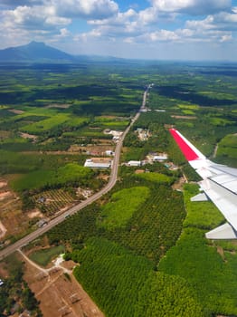 The view from the airplane window to the ground. Landscape view from the sky.