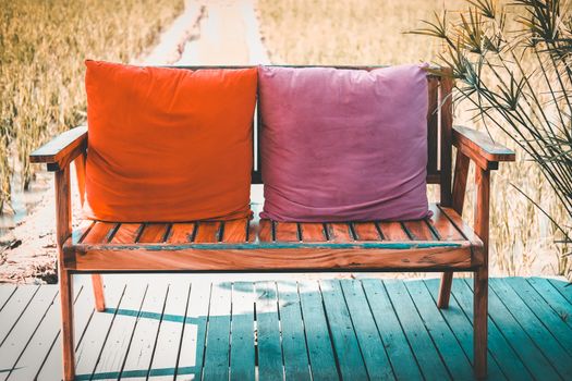 wooden chair bench seat on terrace patio in rice paddy field