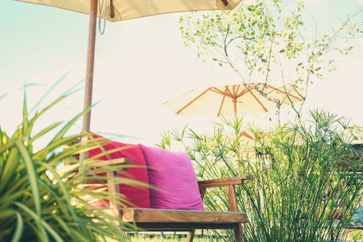 wooden chair bench seat on terrace patio in rice paddy field