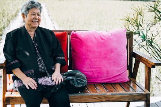 asian elderly woman elder  resting relaxing outdoors. senior leisure lifestyle
