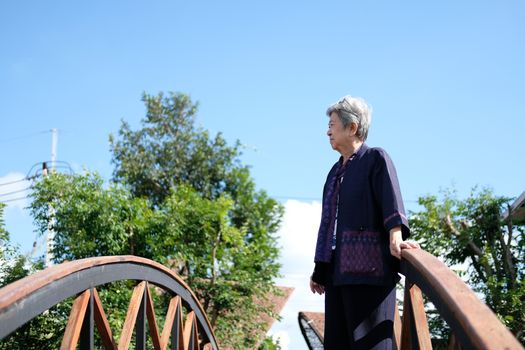 asian elderly woman elder  resting relaxing outdoors. senior leisure lifestyle