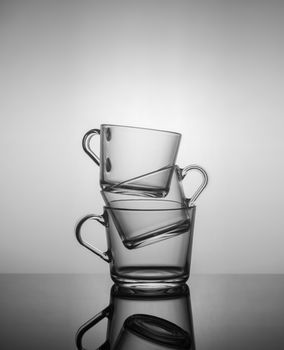 empty tea mugs stacked on top of each other on dark background.