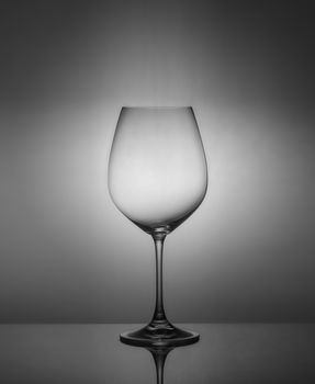 .empty drink glasses on dark background with back light.