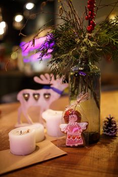 Minimalistic Christmas decor cozy warm room with wooden furniture.