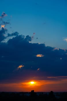 Heavy cloudy sky at sunset. A landscape of beautiful nature.