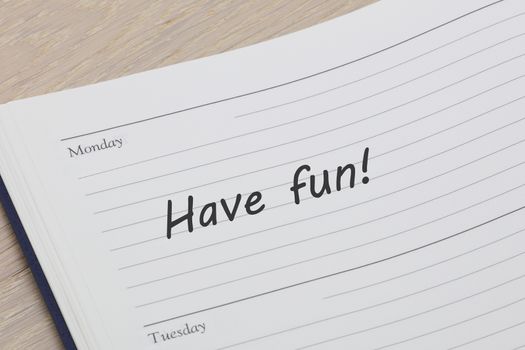 A have fun reminder note in a diary page
