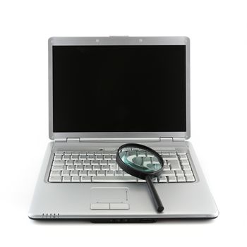 A Laptop PC and magnifying glass indicating data security concept