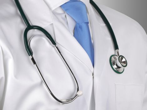 A doctor in white lab coat with stethoscope hung around his neck