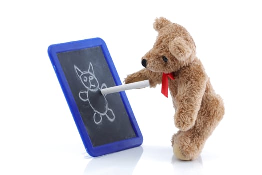 A cute teddy bear drawing on a chalk board
