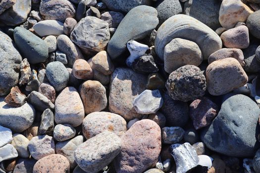 Beautiful stone pebbles at the beach of the baltic sea in the north of Germany