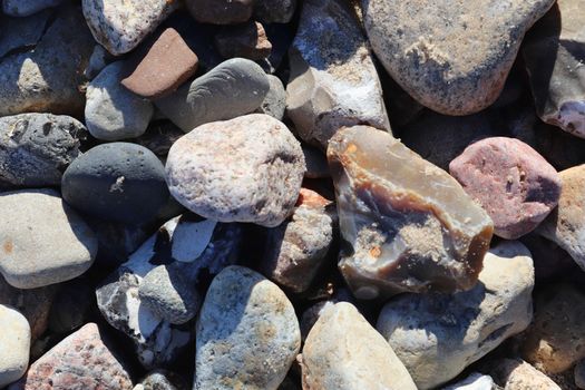 Beautiful stone pebbles at the beach of the baltic sea in the north of Germany