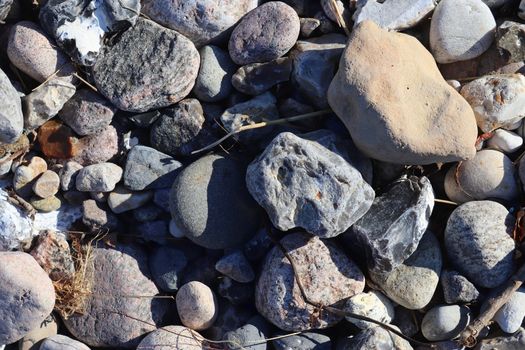 Beautiful stone pebbles at the beach of the baltic sea in the north of Germany